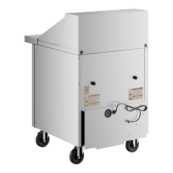 A white True refrigerated sandwich prep table with wheels.