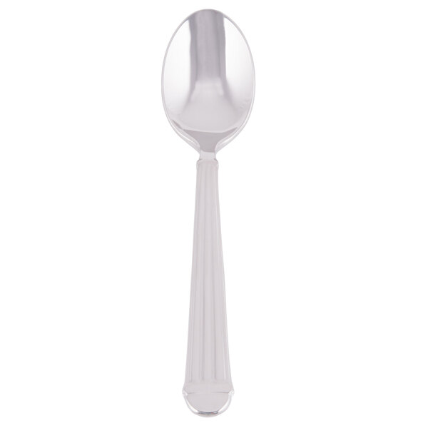A stainless steel demitasse spoon with a white handle and silver spoon.