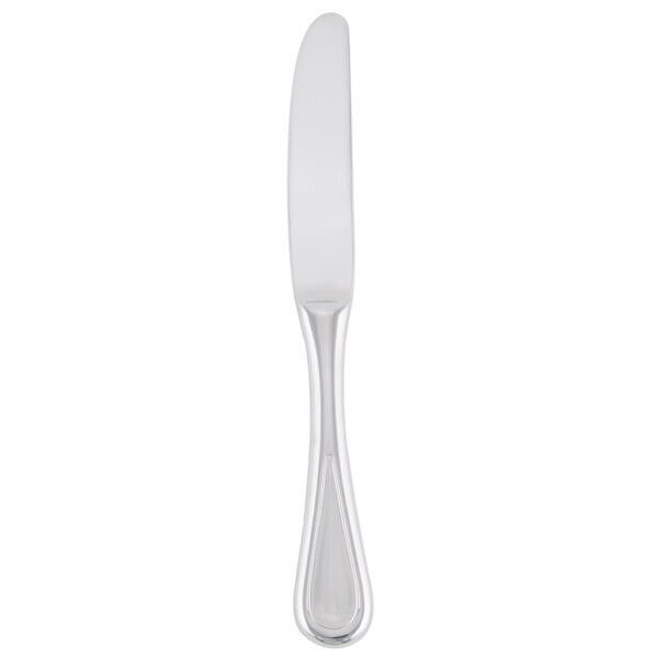 A silver bread and butter knife with a white handle.