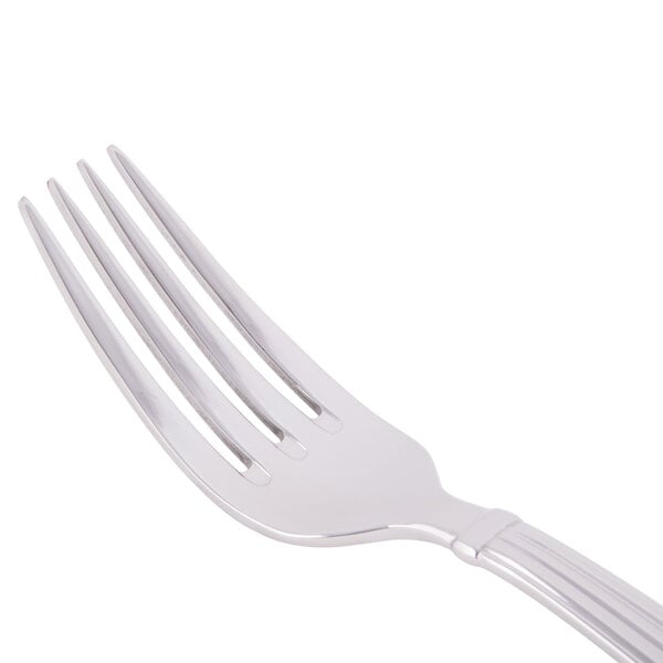 A Libbey stainless steel dinner fork with a silver handle.