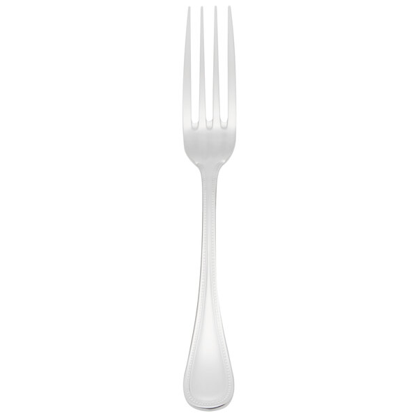 A Libbey stainless steel dinner fork with a white handle on a white background.