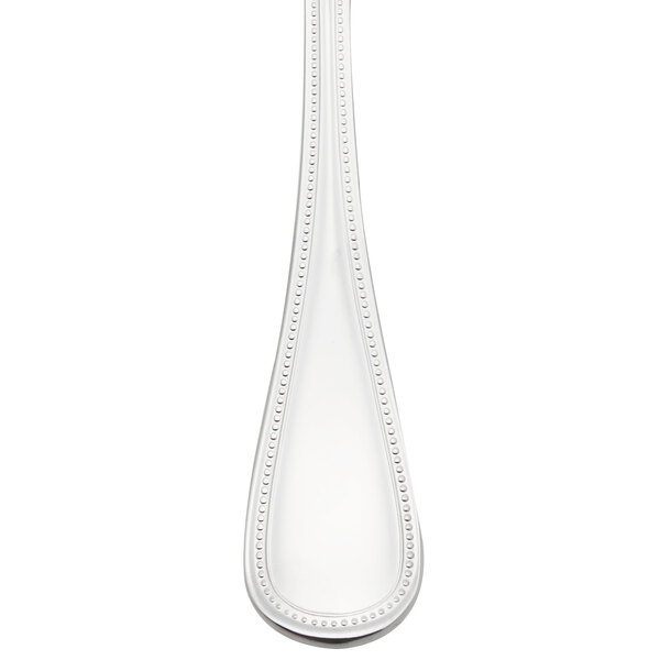 A Libbey Calais stainless steel soup spoon with a beaded handle.