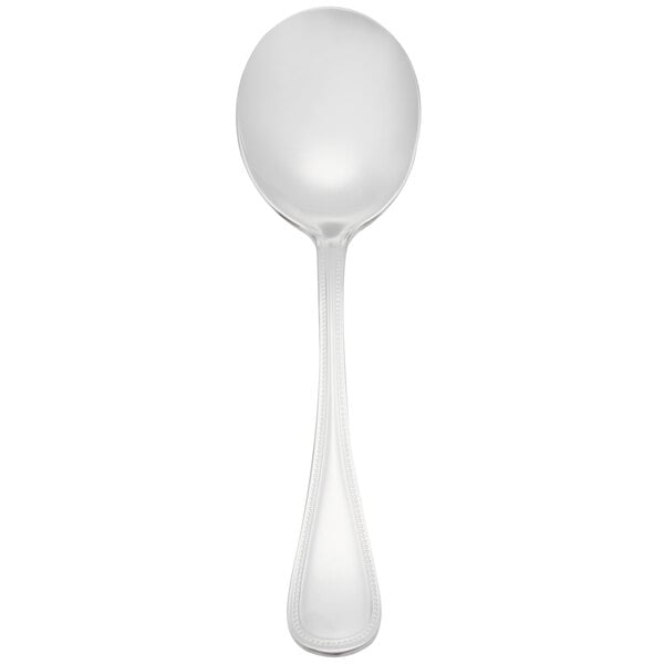 A Libbey stainless steel soup spoon with a white background.