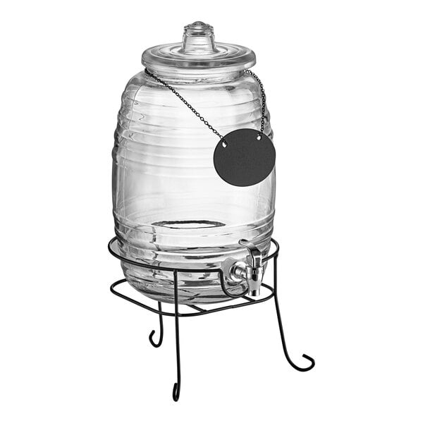 An Acopa glass beverage dispenser on a black stand with a black label.