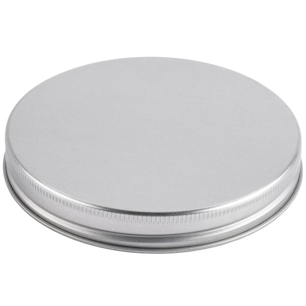 A silver metal lid for an Acopa Mason jar beverage dispenser.