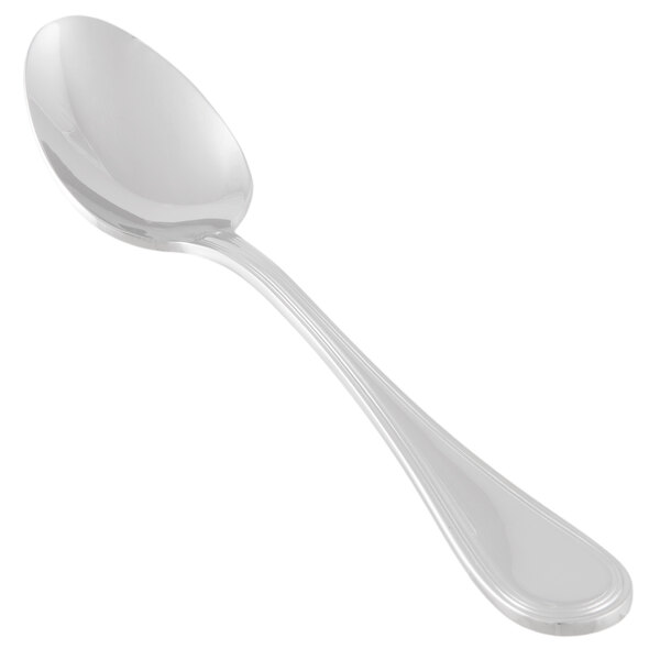 A close-up of a Libbey stainless steel dessert spoon with a silver handle.