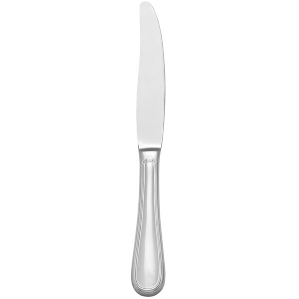 A close-up of a Libbey stainless steel dinner knife with a hollow handle.