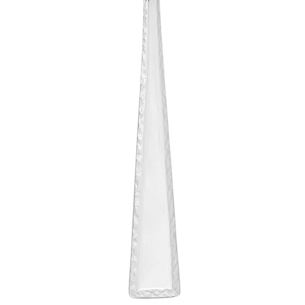 A stainless steel salad fork with a pointed triangular design.