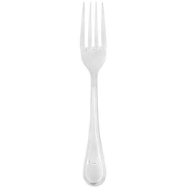 A silver Libbey Geneva dinner fork with a white background.