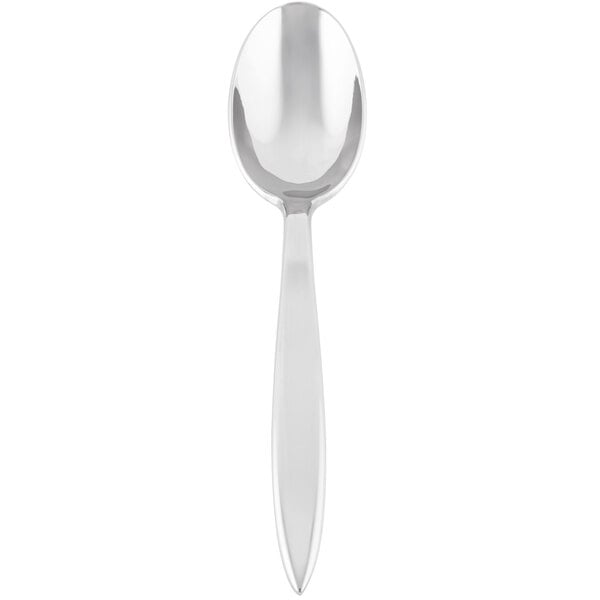 A close-up of a Libbey stainless steel dessert spoon with a white handle.