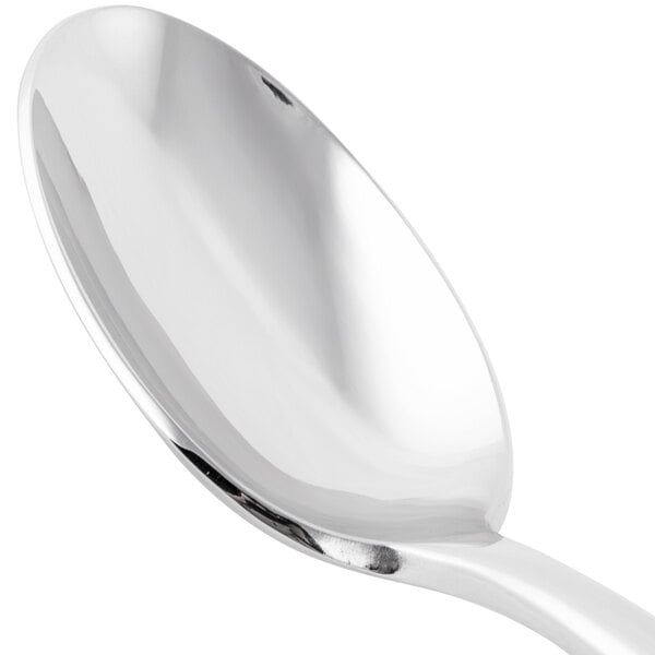 A Libbey stainless steel dessert spoon with a silver handle.