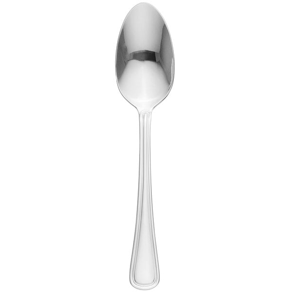 A Libbey stainless steel serving spoon with a silver handle.