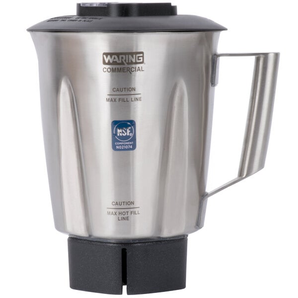 A Waring stainless steel blender jar with a black lid.