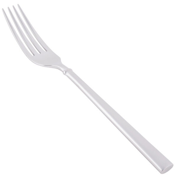 A Libbey stainless steel dinner fork with a white handle.
