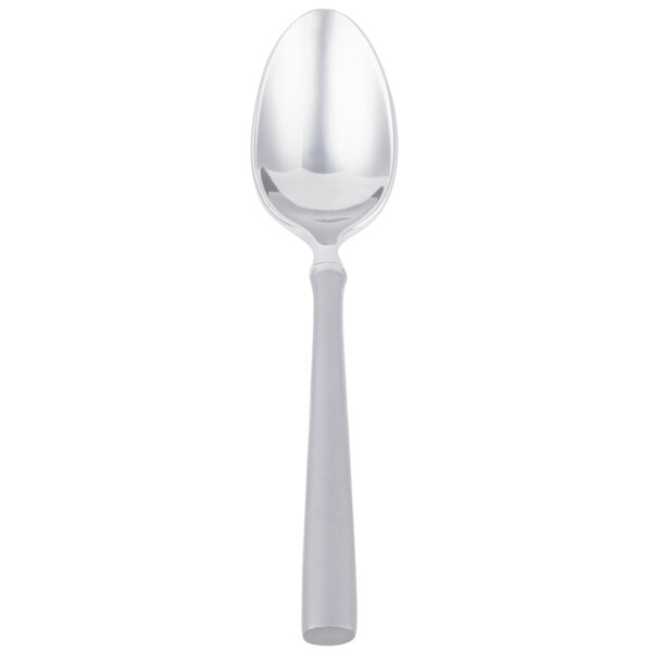 A silver spoon with a white handle.