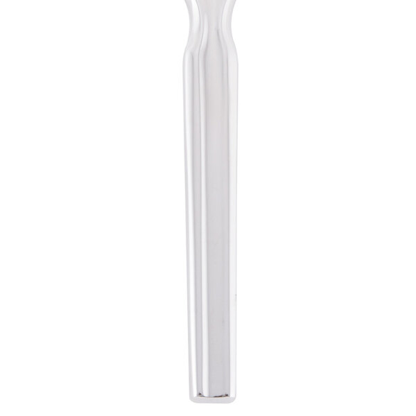 A silver Libbey Madison stainless steel dinner knife with a white background.