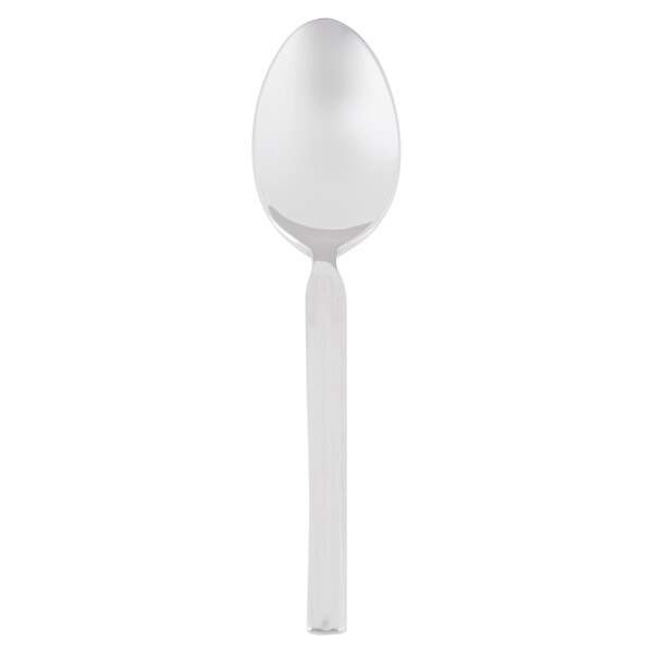 A stainless steel Libbey demitasse spoon with a white handle.