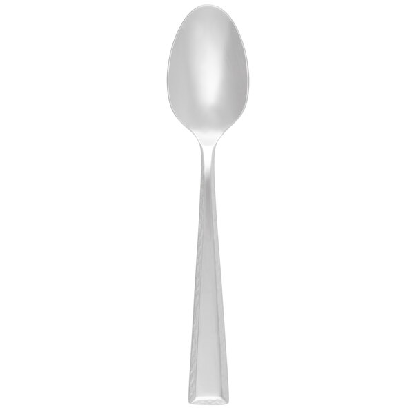 A Libbey stainless steel dessert spoon with a silver handle.