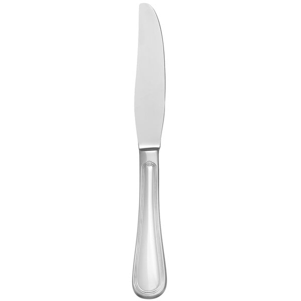 A silver dessert knife with a white background.