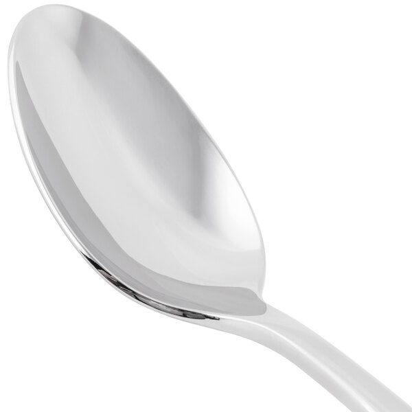 A Libbey stainless steel teaspoon with a white handle.