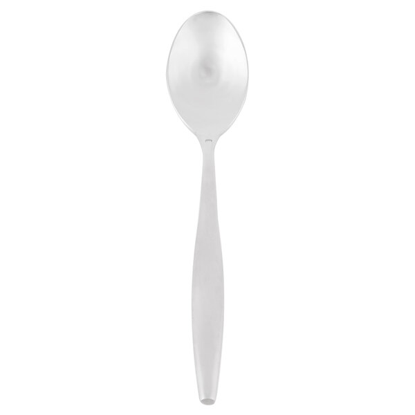 A Libbey stainless steel serving spoon with a white handle.