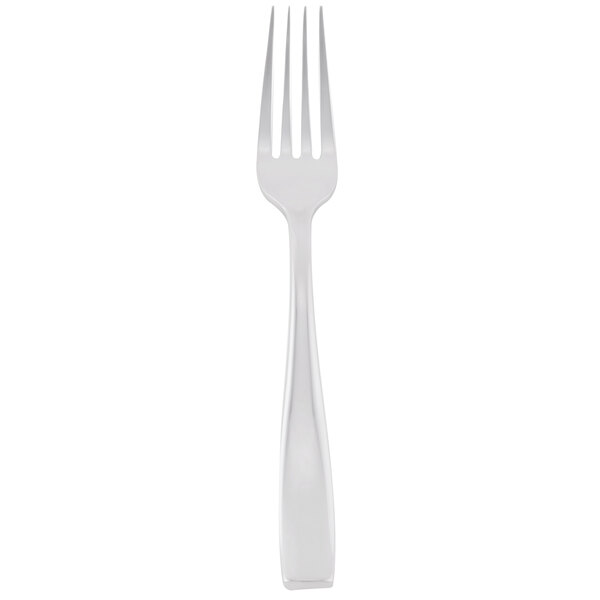 A silver Libbey stainless steel dinner fork with a white background.