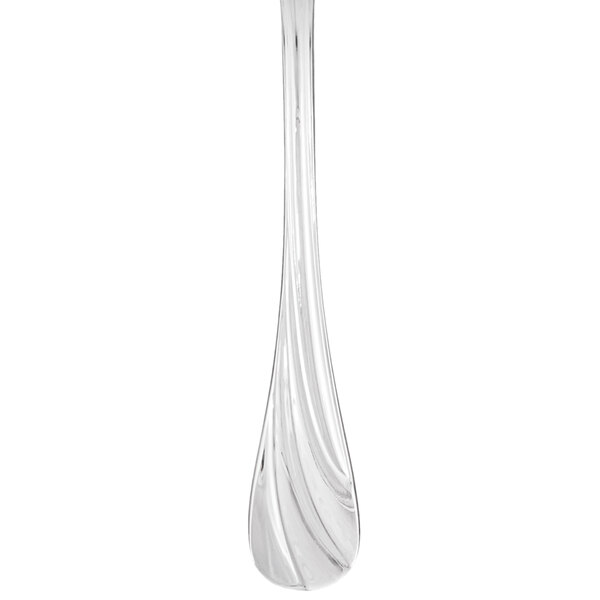 A clear glass utensil with a curved handle.