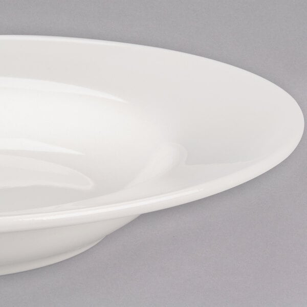 A Libbey ivory porcelain pasta bowl with a wide rim.