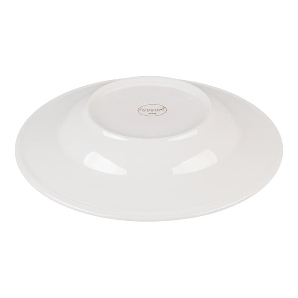 A white porcelain bowl shown upside down, displaying its smooth surface and a small circular base with a logo.
