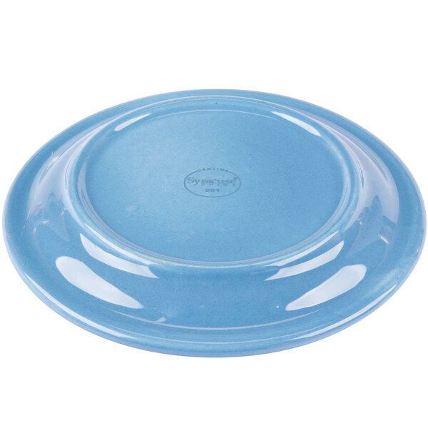 A close-up of a Libbey blueberry carved porcelain saucer with a round rim on a white background.