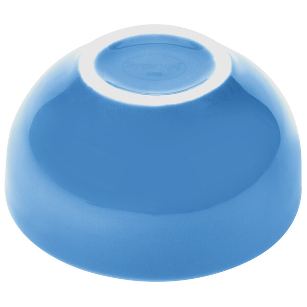 A blue bowl with a white rim.