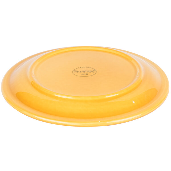 A yellow porcelain plate with a black logo on it.