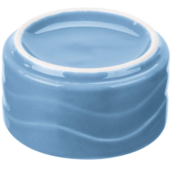 A blue bowl with a white rim.