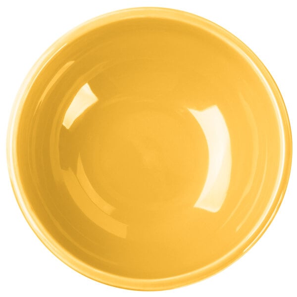 A yellow bowl with a white background.
