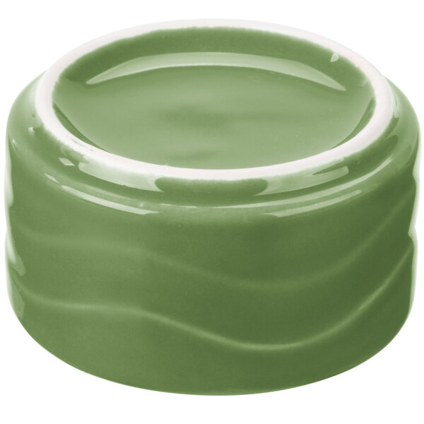 A green bowl with a white rim.