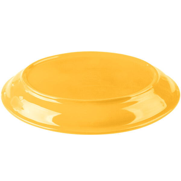 A yellow Libbey porcelain platter with a white background.