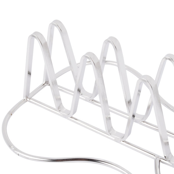 A silver stainless steel guitar-shaped Clipper Mill taco holder.