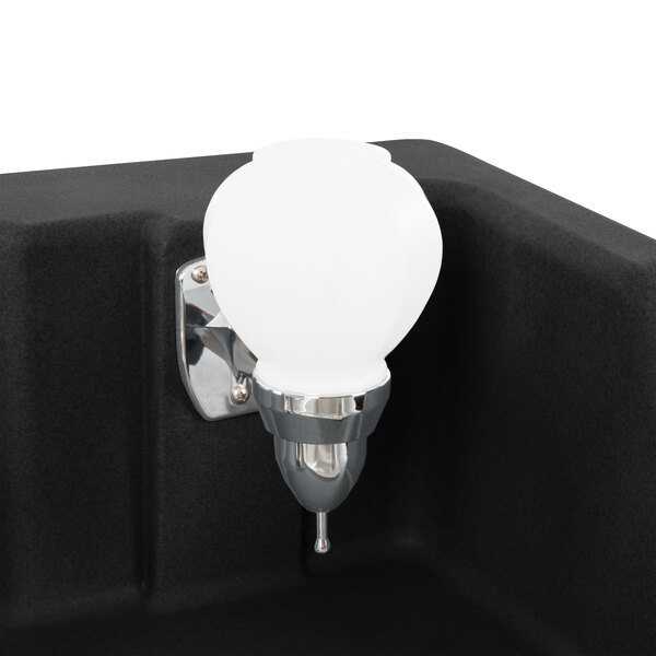 A white light bulb mounted on a black CamKiosk hand sink cart.