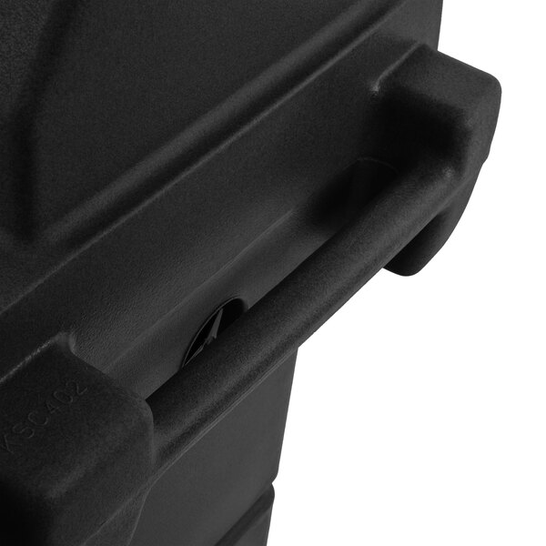 A black plastic Cambro cart with a granite gray door on a table.