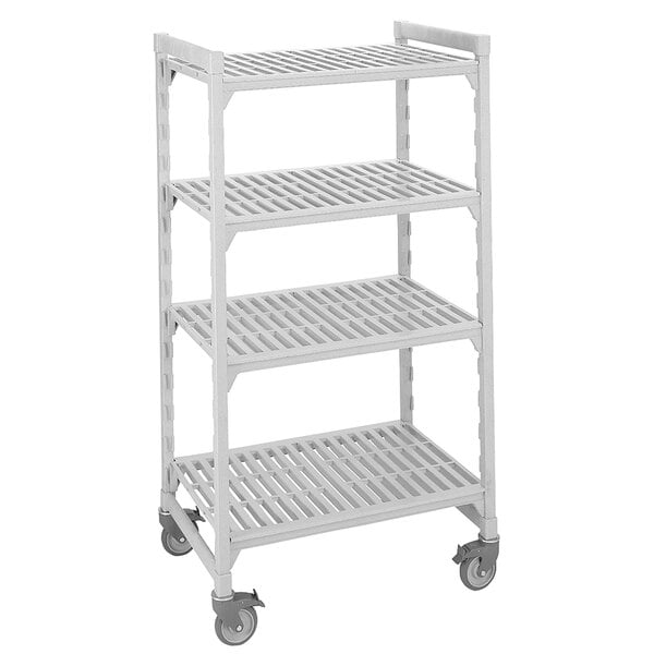 A white plastic Cambro Camshelving premium shelving unit on wheels.