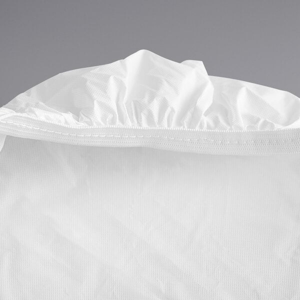 A white rectangular plastic tablecloth with elastic.