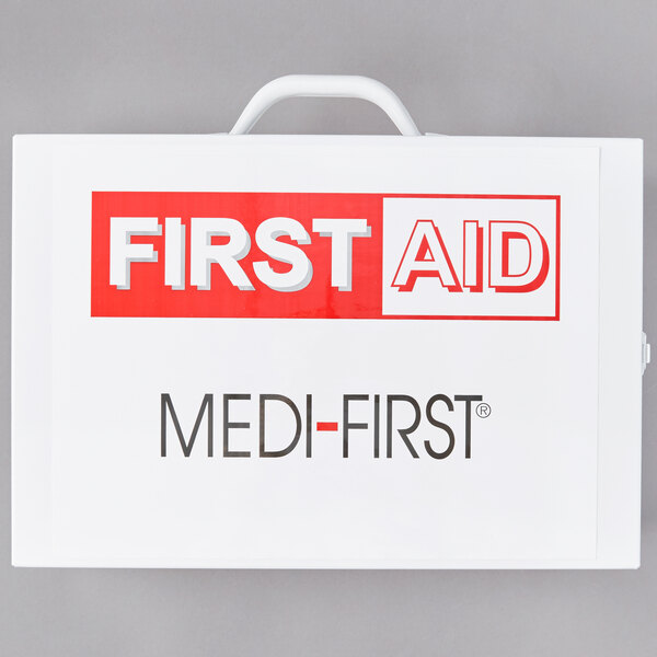 A white Medique first aid kit cabinet with red and black text.