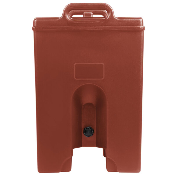 A red plastic container with a black handle.