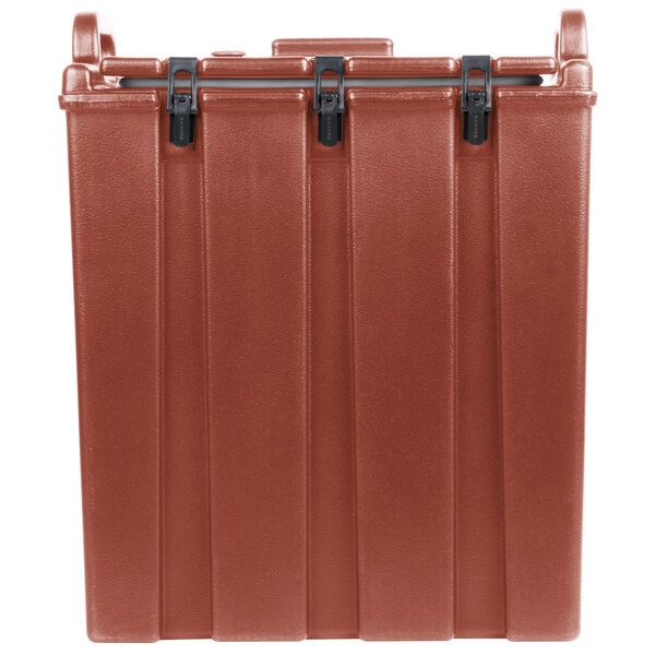 A brick red plastic container with black handles.