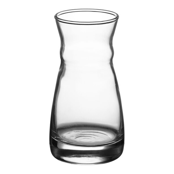 An Arcoroc clear glass carafe with a curved neck.