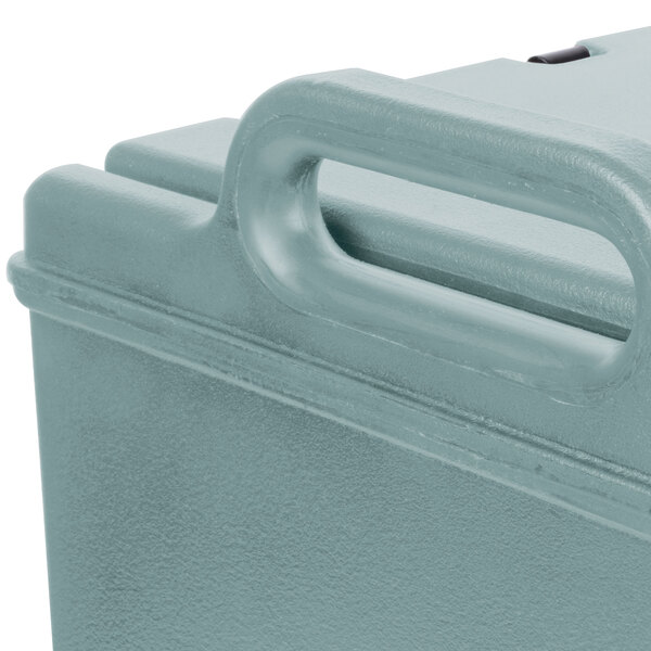 A slate blue Cambro Camtainer insulated soup carrier with handles.