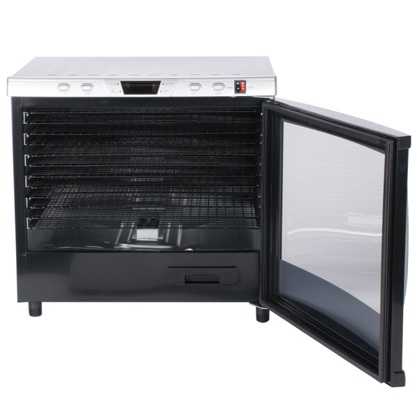 A Weston food dehydrator with a glass door open on a rack inside.