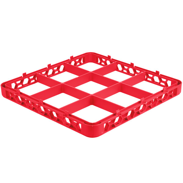 A red plastic Carlisle OptiClean glass rack extender with nine compartments.