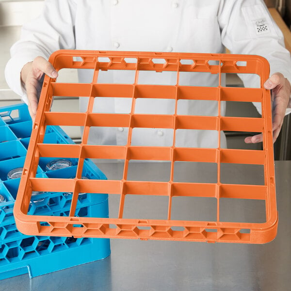 A person holding an orange Carlisle glass rack extender.