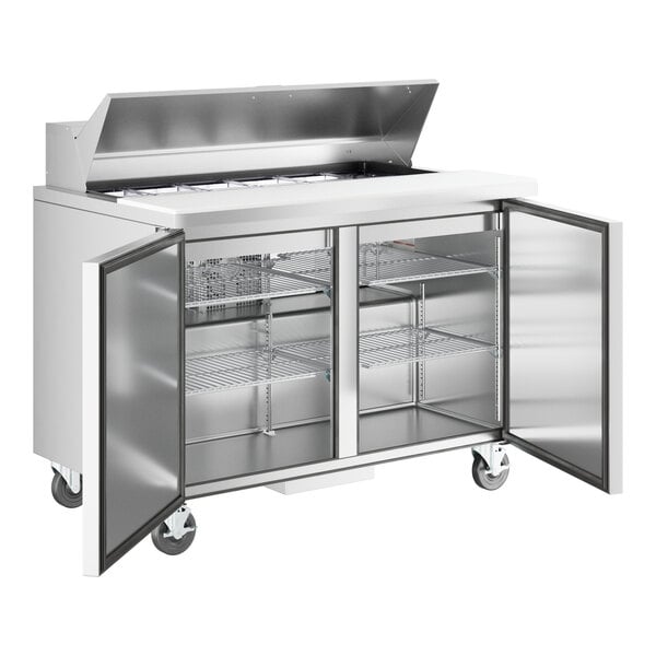 A stainless steel True refrigerated sandwich prep table with two doors.